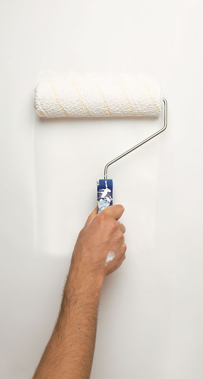 Paint roller applying fresh paint